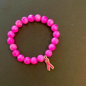 In the pink stretch handcrafted breast cancer bracelet.